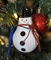 Old lightbulbs can be transformed with puffy paint, buttons, sparkle pipe cleaner and a little glitter!