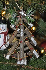 The 'twig' Christmas tree is made from twine, twigs, and a little white paint.