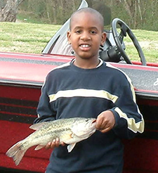 Boy holding a fish