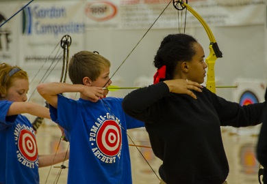 Student archers from Pomaria Middle School in S.C.  (blue shirts) along with fellow competitors from other states, show their intensity at the NASP World Tournament in Myrtle Beach.  photo by David Lucas, SCDNR