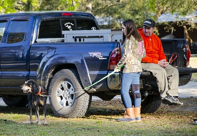 A young competitor and her hound wait for the start of the 2017 State Championship Youth Coon Hunt at the SCDNR's Webb Wiuldlife Center. This year's championship will be held March 3, 2018.