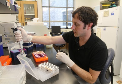 Fisheries research biologist processing samples