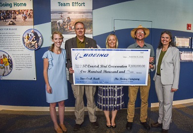 Boeing South Carolina has provided a generous donation of $100,000 to the support the efforts of the South Carolina Coastal Bird Conservation Program to restore critical sea and shorebird nesting habitat on the SCDNR's Crab Bank Seabird Sanctuary. Pictured at the November 8 ceremony dedicating the gift are (left to right): Coastal Conservation League Communications Director Caitie Forde-Smith, SCDNR Director Alvin Taylor, Boeing S.C. Senior Director of National Strategy and Engagement Lindsay Leonard, the Coastal Expeditions Foundation's Capt. Chris Crolley and Audubon S.C. Executive Director Sharon Richardson. [SCDNR photo by Taylor Main]