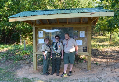 Eagle Scout David Helm (center) of Spartanburg completed the requirements of his Eagle Scout award by designing and leading construction of a kiosk at Thurmond Dove Field in Union County, a public dove field managed by the South Carolina Department of Natural Resources (SCDNR). At left is David's mother, Audra, and at right is Craig Brooks, Scoutmaster of Troop 5 at St. John's Lutheran Church in Spartanburg. (Photo: Greg Lucas/SCDNR)
