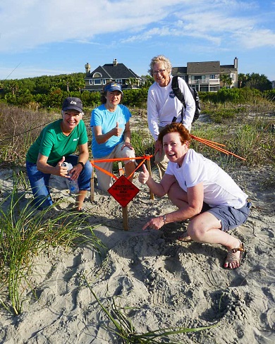 Volunteers with the Isle of Palms/Sullivan's Island turtle team celebrate the state's first nest of the season. (Photo: Barb Bergwerf)
