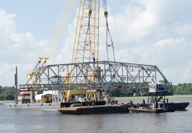 The bridge section is lowered onto a waiting barge. (Photo: Cameron Rhodes)