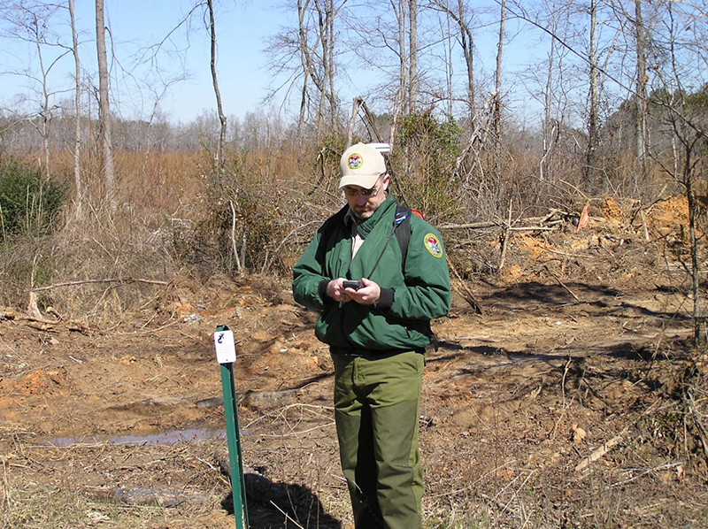 SCDNR wildlife biologist Jay Butfiloski conducts fieldwork with GPS tracking equipment. Butfiloski was recently honored by the S.C. chapter of The Wildlife Society with that group's Professional Wildlife Management award. [SCDNR photo]