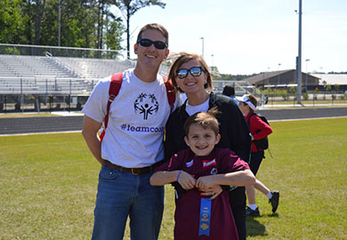 1st Sgt. Earl Pope at the Special Olympics with his wife and son, Cooper.