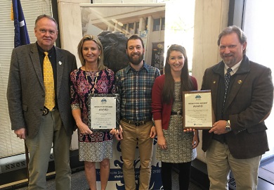 SCDNR staff receiving 'Notable State Document' awards for 2016 pose for a photograph, March 17, 2017 at the State Library in Columbia. From left to right: SCDNR Director Alvin Taylor, State Climatologist Hope Mizzell, GIS manager Tanner Arrington, Marine Division Science Writer Erin Weeks and Public Information Coordinator David Lucas.  SCDNR photo by Greg Lucas