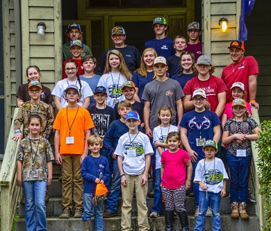 Participants in the 2019 S.C. State Youth Coon Hunt Championship pose for a group photo on the steps of the historic lodge at the SCDNR's James W. Webb Wildlife Center. [SCDNR photo by D. Lucas]