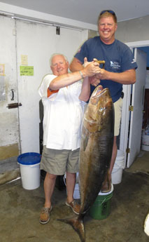 Photograph of Record Amberjack with two men