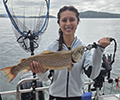 a girl holding a Brown Trout