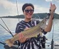 a girl holding a Brown Trout