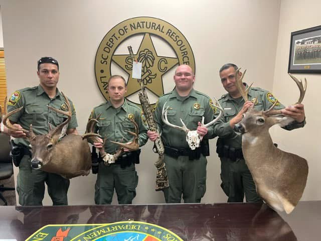 SCDNR officers standing with taxidermy