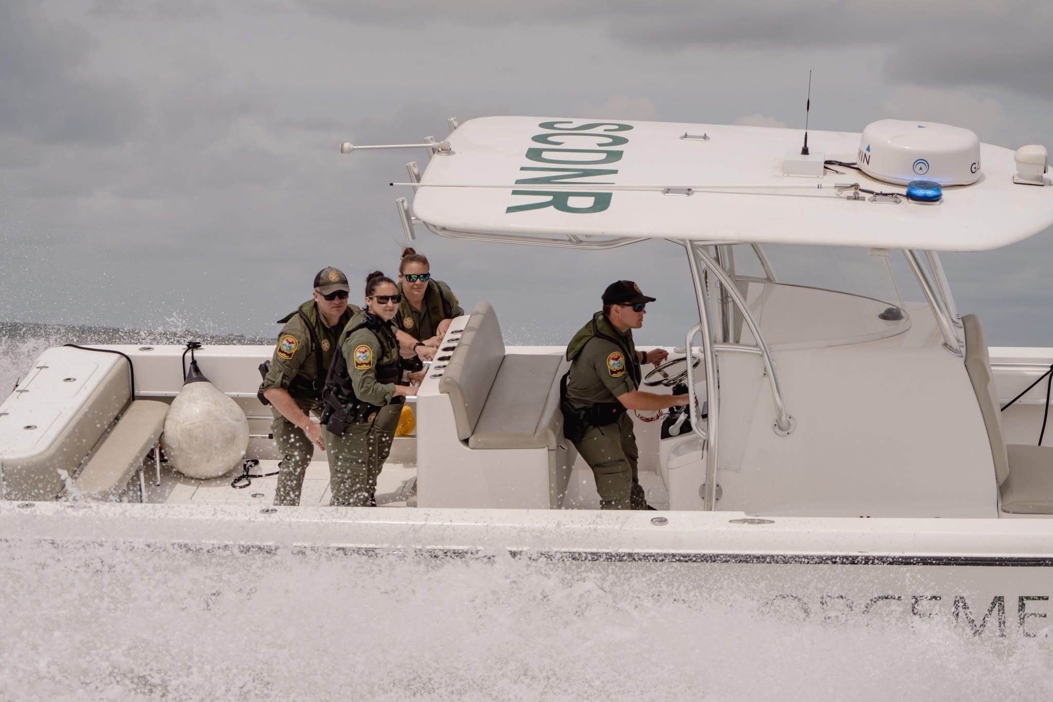 SCDNR Coast Watch employees on a boat in the water