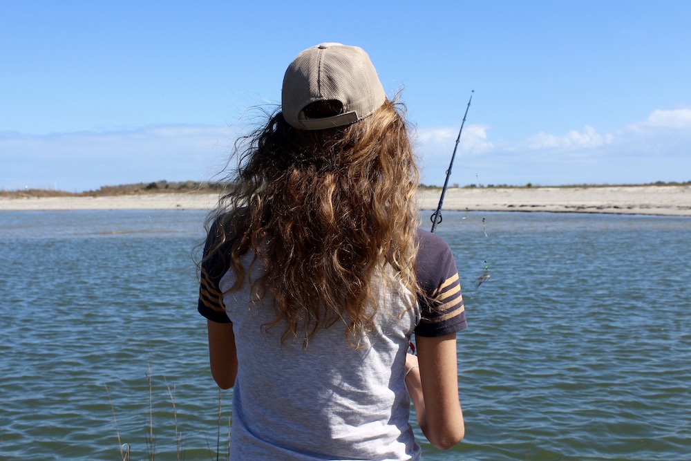 A woman shore fishing