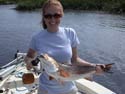 Sara Spring with a red drum ready for release.